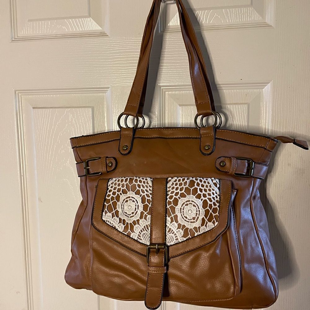 Olivia Miller brown  shoulder bag embellished with beige crochet appliqué .